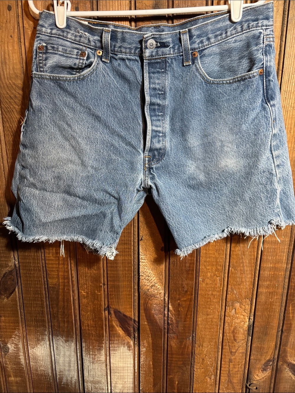 Levi's 501 distressed and faded light blue denim cutoff shorts